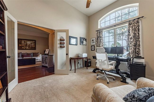 Another view of this room with the large windows looking out towards the front yard. | Image 19