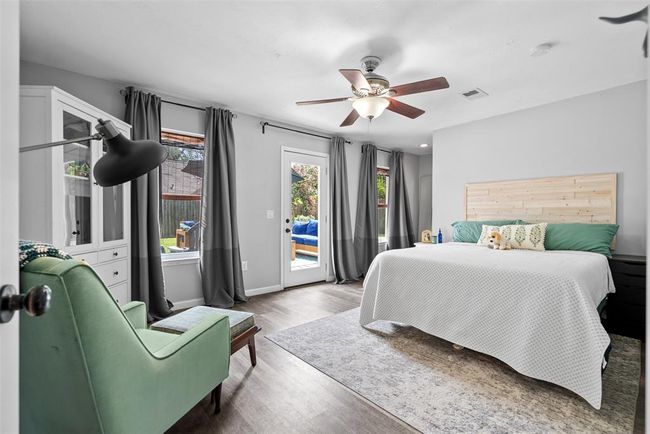 Inviting Guest Suite with direct patio access for seamless indoor-outdoor living. | Image 6