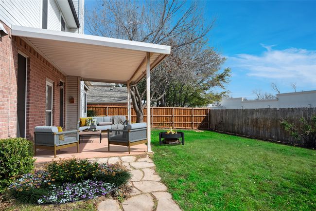 Virtually staged view of covered patio - great for al fresco dining and outdoor entertaining | Image 37