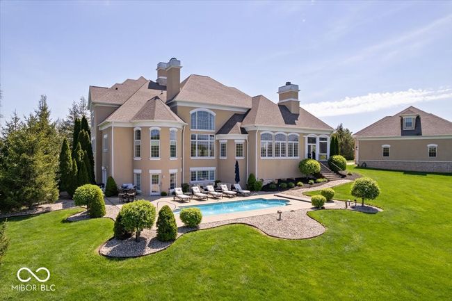 Pride of ownership is evident by the lush, beautifully manicured lawn and landscaping. | Image 6