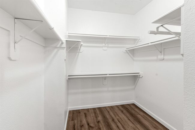 Spacious closet featuring wood finished floors | Image 27