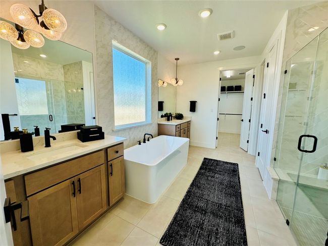 Primary Bath retreat with dual vanities, garden tub & walk-in shower | Image 11