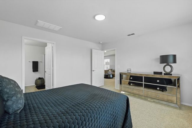 Bedroom with baseboards and visible vents | Image 17