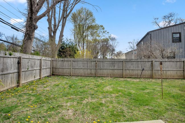 View of yard with a fenced backyard | Image 12