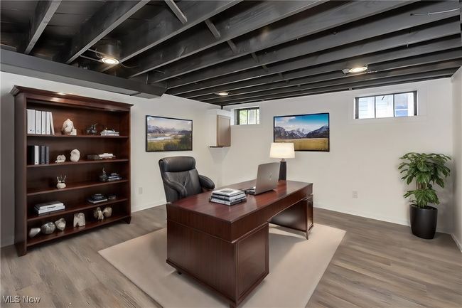 Office area featuring beam ceiling and hardwood / wood-style flooring | Image 45