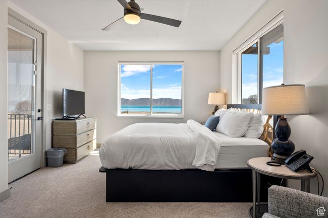 Bedroom with carpet, a ceiling fan, and access to exterior | Image 52