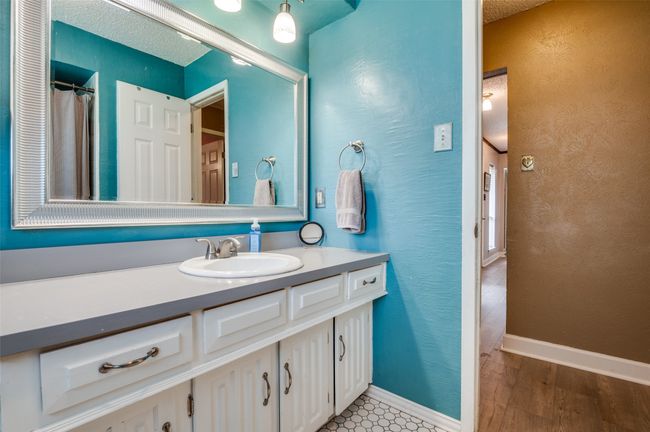 Full bathroom with wood finished floors and vanity | Image 21