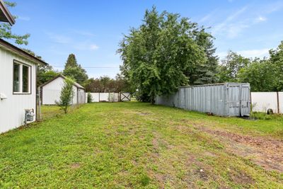 This property is on a double lot and one of the lots has been fully fenced in and includes a gate for secure access. Great for storing larger items like campers, fish houses, trailers, etc... | Image 3