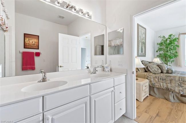 Master Bathroom featuring wood-type flooring and double sink vanity | Image 23
