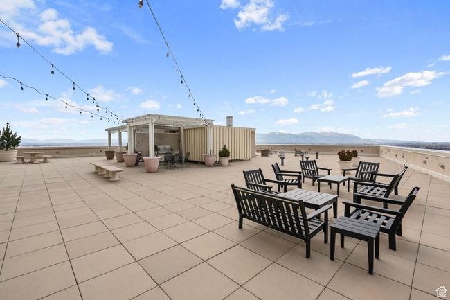 View of patio / terrace with a mountain view, a pergola, and an outdoor fire pit | Image 40