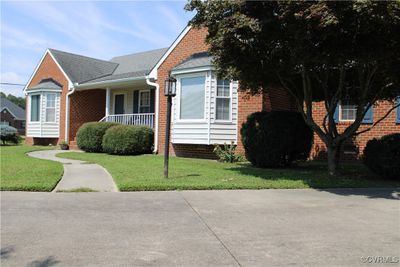 Bungalow-style house with a front lawn | Image 2