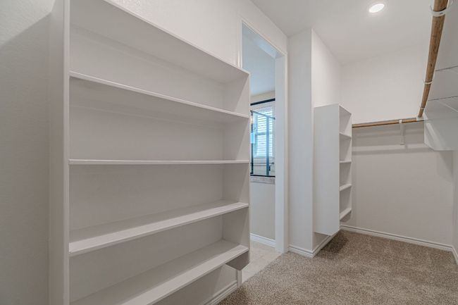 Walk in closet with carpet flooring | Image 29
