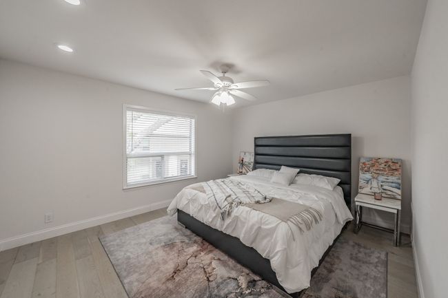 Bedroom featuring light wood-type flooring, baseboards, recessed lighting, and ceiling fan | Image 18