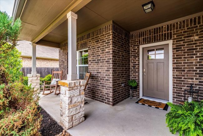 Gorgeous front porch with stone column accents | Image 4