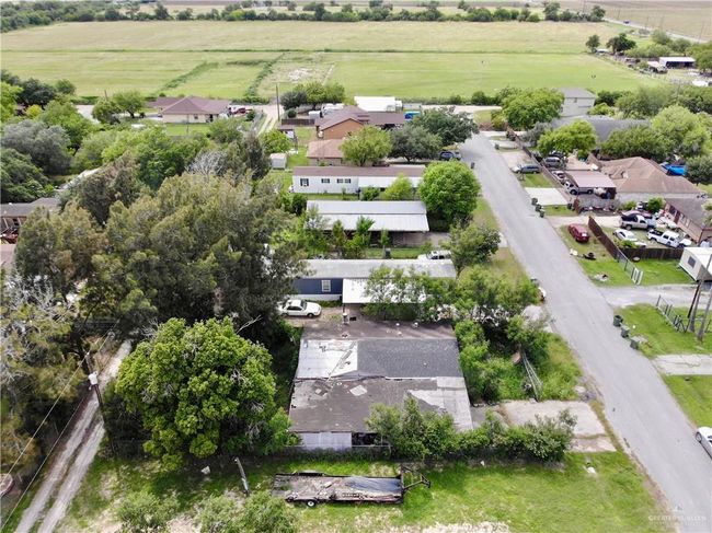 Aerial overview of property's location with rural landscape and nearby suburban area | Image 8