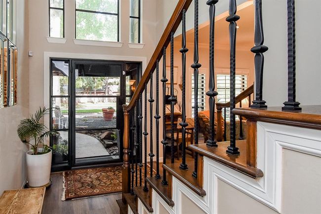 Beautiful steel and glass doors, bring elegance and light to this welcoming entry. | Image 7