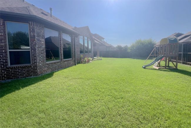 View of yard featuring a playground | Image 39