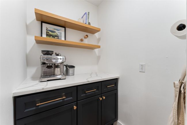 A spacious walk-in coffee bar can also serve as a walk-in pantry or discreet appliance storage | Image 12