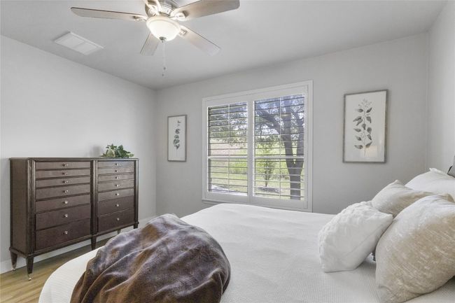 Spacious primary bedroom with attached bathroom en suite | Image 13