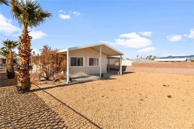 Back of property featuring a patio area and a fenced backyard | Image 38