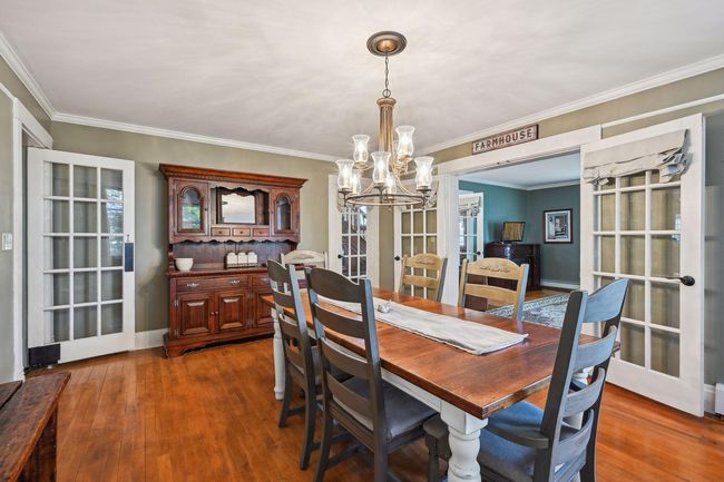 Another view of the formal dining room. You can see the swinging door on the left to the kitchen, french doors on the right to the living room and the single door next to the buffet accessing the front foyer. | Image 34