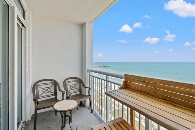 Balcony with view of water and beach | Image 4