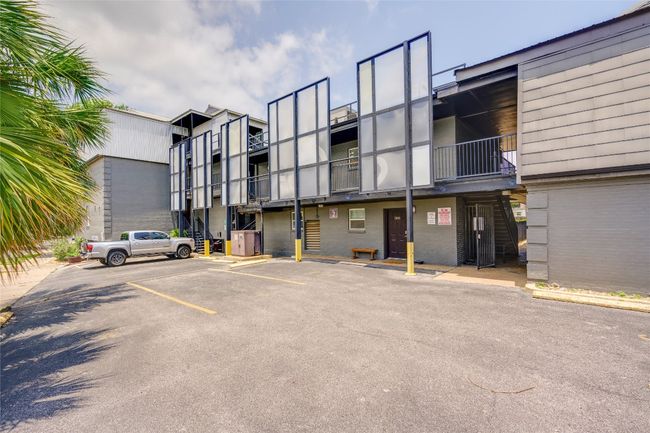 View of building exterior with uncovered parking | Image 6