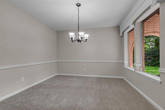 Plenty of room in this formal dining space for entertaining. | Image 11