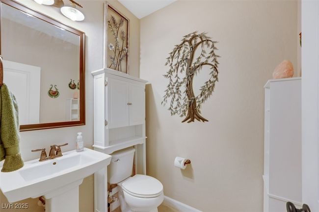 Half bathroom with toilet and a sink | Image 29