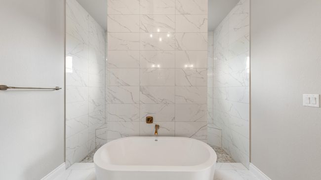 Full bath with a freestanding tub and marble finish floors | Image 27