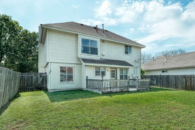 Rear view of property featuring a wooden deck | Image 11