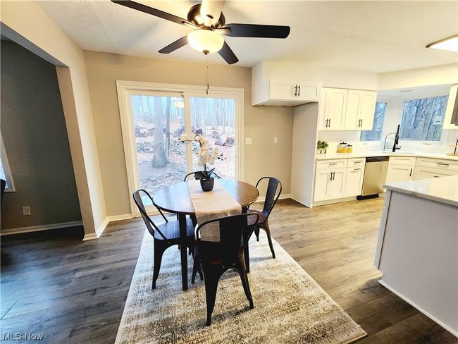 Dining area with ceiling fan, light wood-type flooring, and sink | Image 14