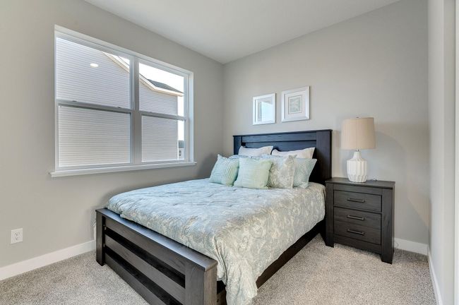 Third bedroom of three total. Photo is of a previously built model home, finishes and selections will vary. | Image 16