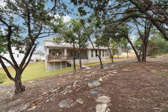 Views of the back exterior and majestic backyard space. | Image 36