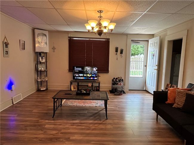 Large family room w/ laminate HW flooring... | Image 7
