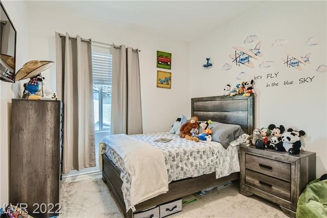 Bedroom with light colored carpet | Image 11