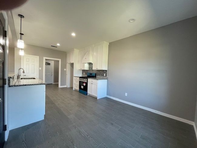 Kitchen facing utility room from dining area | Image 10