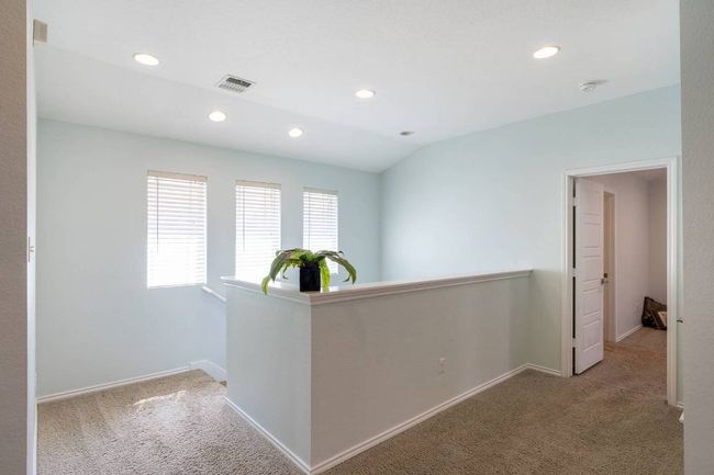 Hallway featuring an upstairs landing, carpet, and recessed lighting | Image 25