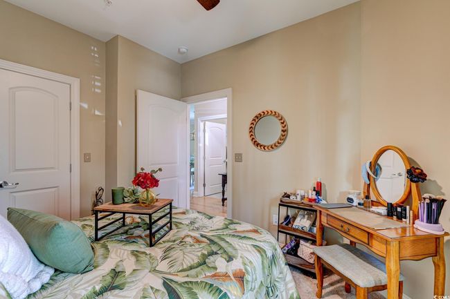 Bedroom featuring a ceiling fan and visible vents | Image 27