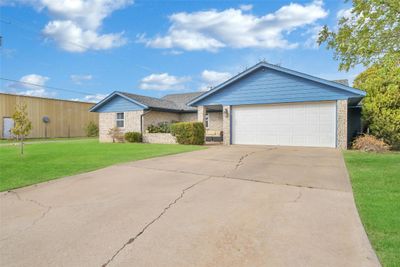 Single story home with a front yard and a garage | Image 3