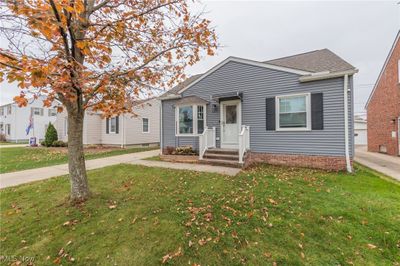 Bungalow-style house with a front lawn | Image 1