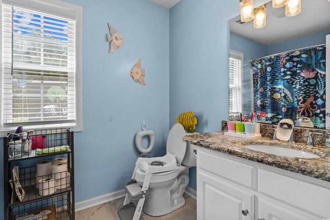 Bathroom featuring vanity and tile patterned floors | Image 14