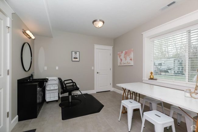 Office with plenty of natural light, baseboards, and visible vents | Image 50