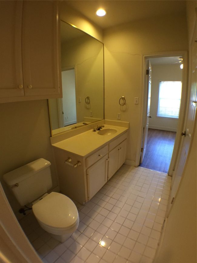 Bathroom featuring recessed lighting, tile patterned flooring, toilet, vanity, and baseboards | Image 7