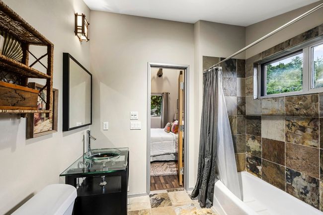 Slate shower and floor photo taken from closet area. | Image 40