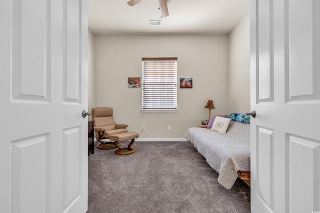 Living area featuring carpet flooring and ceiling fan | Image 11