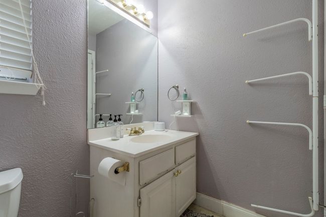 Bathroom featuring toilet and vanity | Image 19