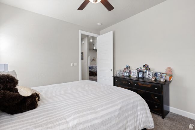 Carpeted bedroom with baseboards and a ceiling fan | Image 27