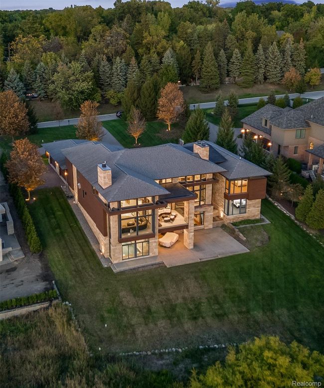 Back of property with a chimney, a patio, and a lawn | Image 37