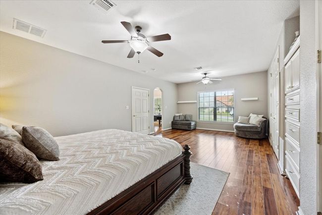 Notice the large sitting area right in front of the double windows of your luxurious primary suite. | Image 20